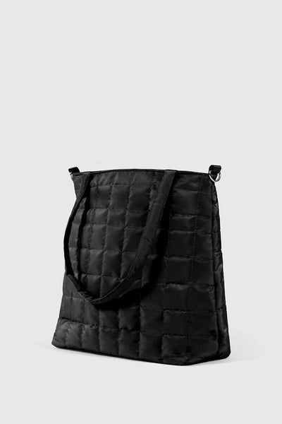 black quilted bag with adjustable straps and pocket