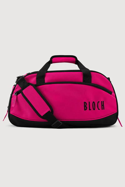 Pink duffel bag with black accents and 'BLOCH' branding on a light gray background