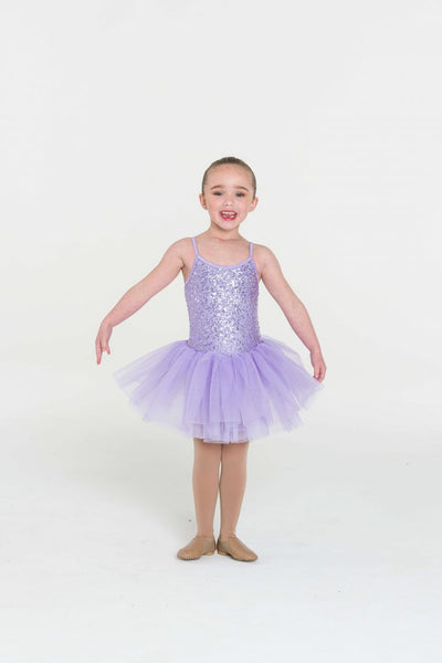 A child wearing a lilac tutu dress with an attached tulle skirt and sequinned bodice