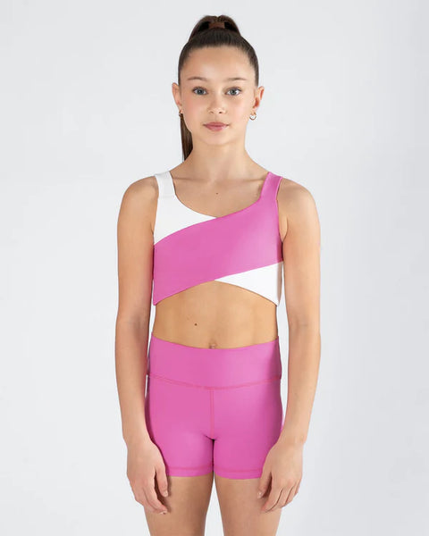 Girl wearing a pink and white sports outfit on a white background