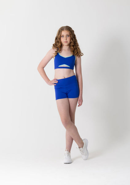 Woman wearing a blue athletic outfit on a white background