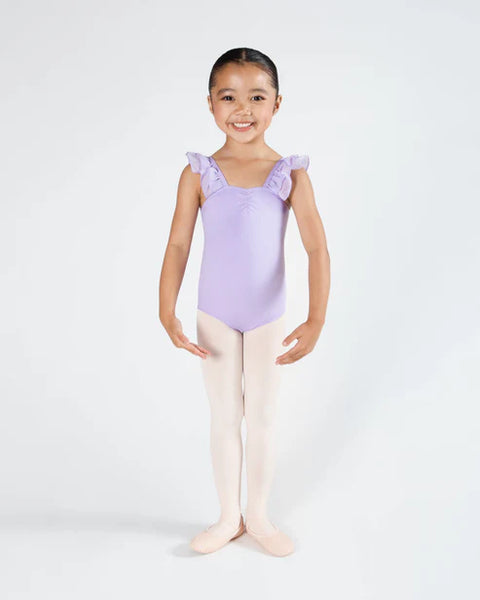 Young girl in a lilac leotard with ruffled shoulders on a white background