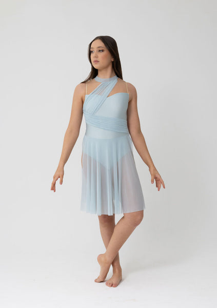 Woman wearing a light blue dress on a white background