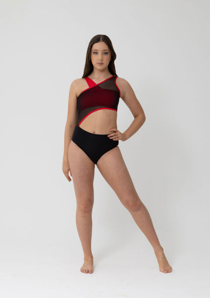 woman wearing red crop top with sheet black leotard over the top on a white background