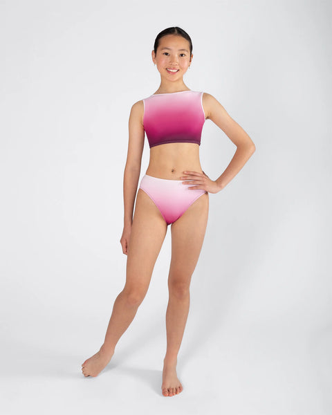 Woman wearing a pink and white ombre activewear set on a white 