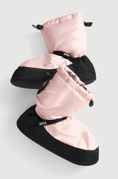 Pair of pink reflective boot covers on a light gray background