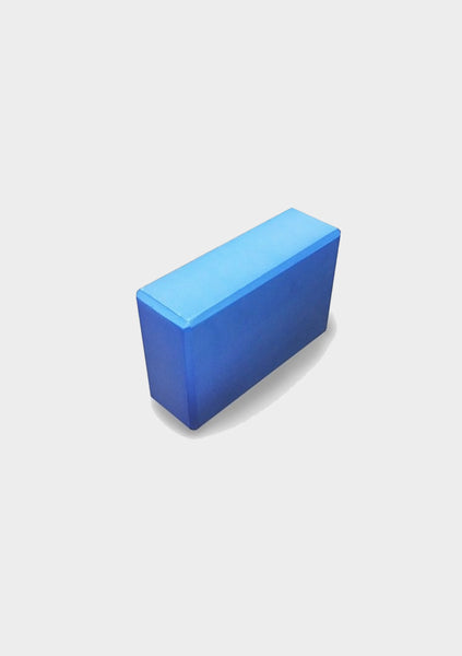 Blue yoga block on a white background