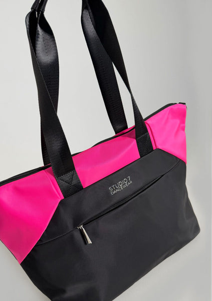 Black and pink tote bag with 'Studio 7' branding on a gray background