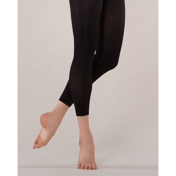 a person wearing black footless tights