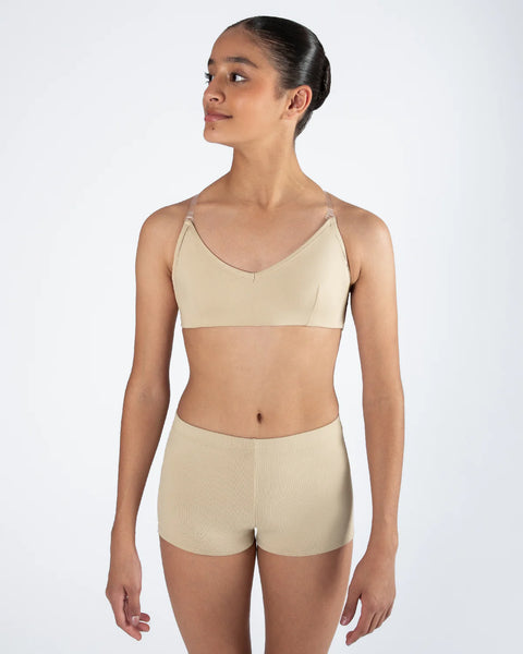 Girl wearing a beige clear back bra and shorts set on a white background