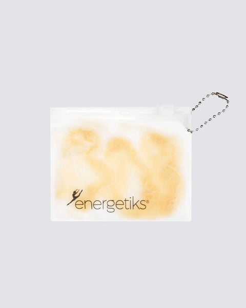 Blonde hair nets on a white bag with 'energetiks' branding on a light gray background