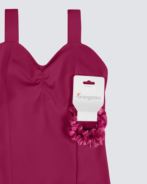 Mulberry Leotard with Matching Bow on a white branded Energetiks card on a light gray background