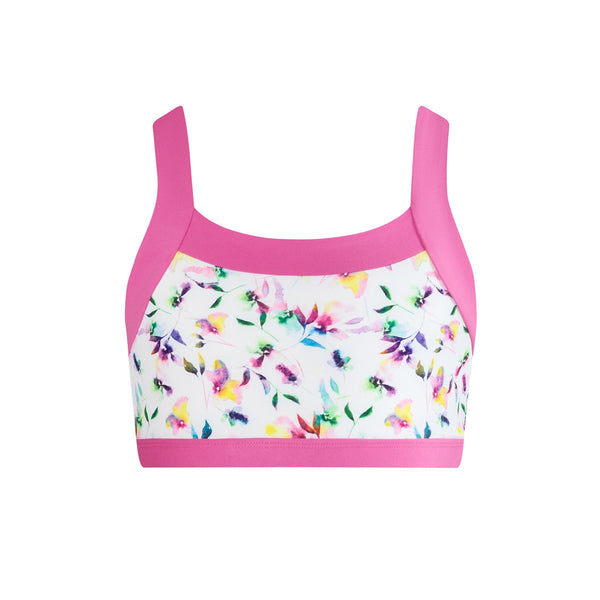 Multicolored floral-patterned sports bra with pink straps on a white background