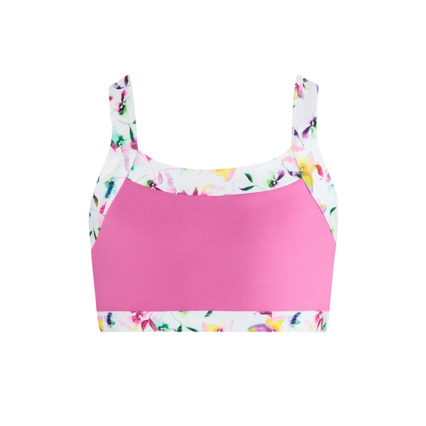 Pink crop top with floral straps on a white background