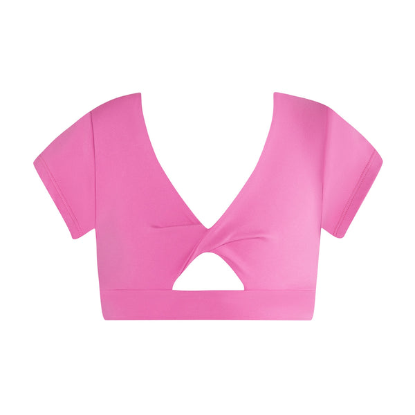 Pink cap sleeve crop with cut out design on a white background