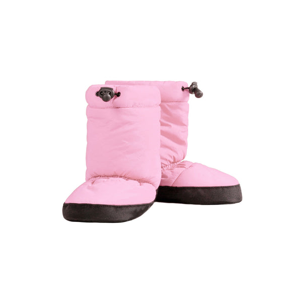 A pair of pink quilted children's warm up cozies with non-slip soles.