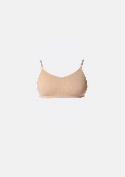 A beige Studio 7 convertible dance bra with a seamless fit and adjustable shoulder straps.