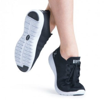Black dance sneaker with a white sole with a visible logo