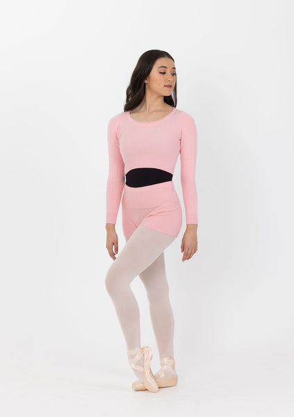 Ribbed warm up top being worn over the top of black leotard with pink shorts,  pale tights and ballet shoes